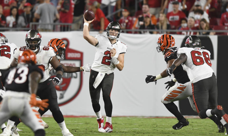 Kyle Trask didn't dazzle in his NFL preseason debut, but that's part of the waiting game with the rookie second-round pick. (AP Photo/Jason Behnken)