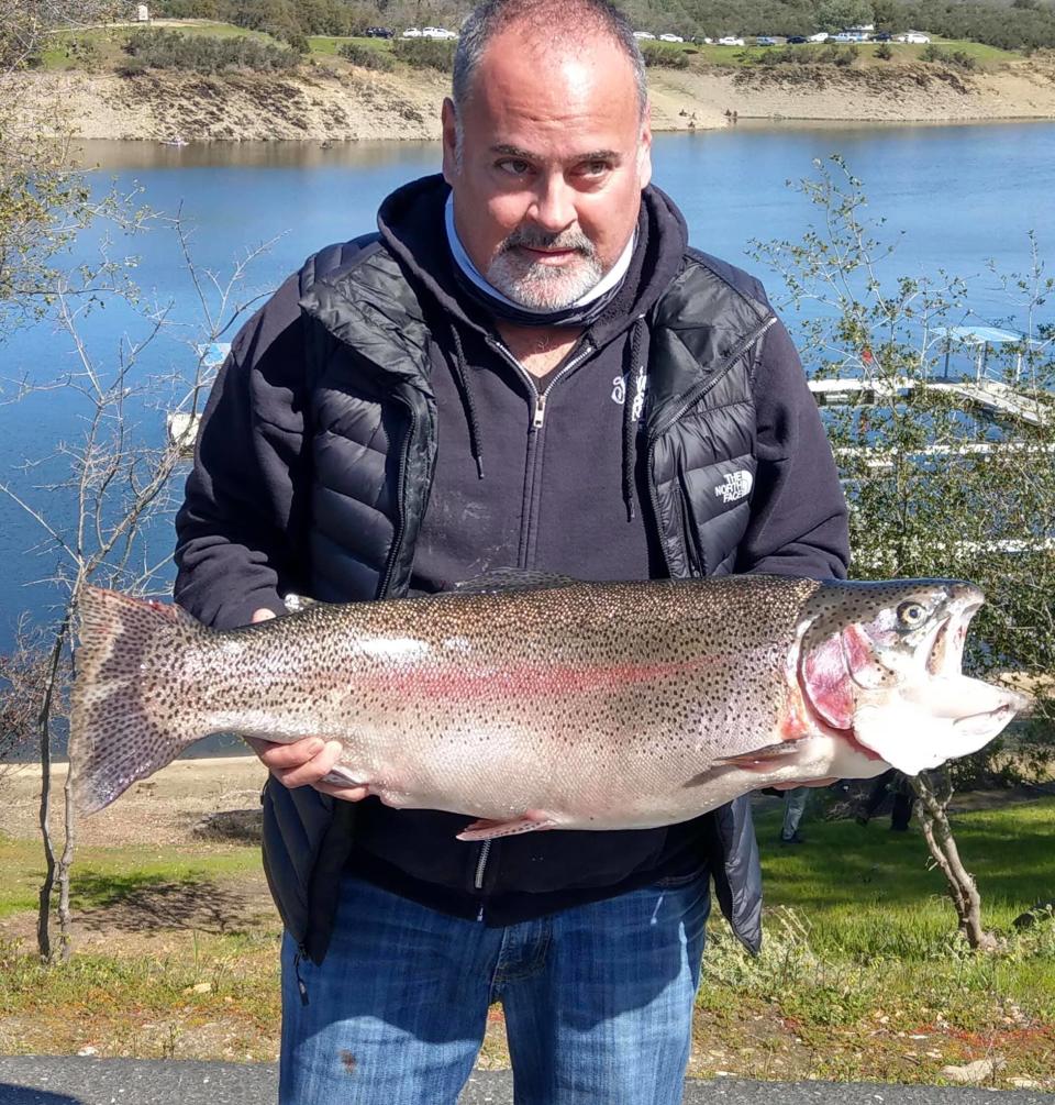 Richard Bartoni of San Ramon successfully battled this new Amador lake record rainbow trout weighing 19.96 pounds while trolling a Rapala on March 6.