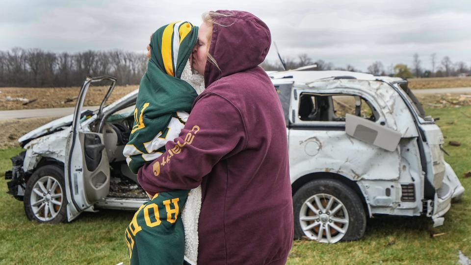 Whitney Smith kisses the cheek of her son Memphis Smith, 2, after surviving the collapse of Freedom Life Church during a severe storm Friday, March 15, 2024, in Winchester. "God protected us," Smith said. "I'm just thankful we're alive."