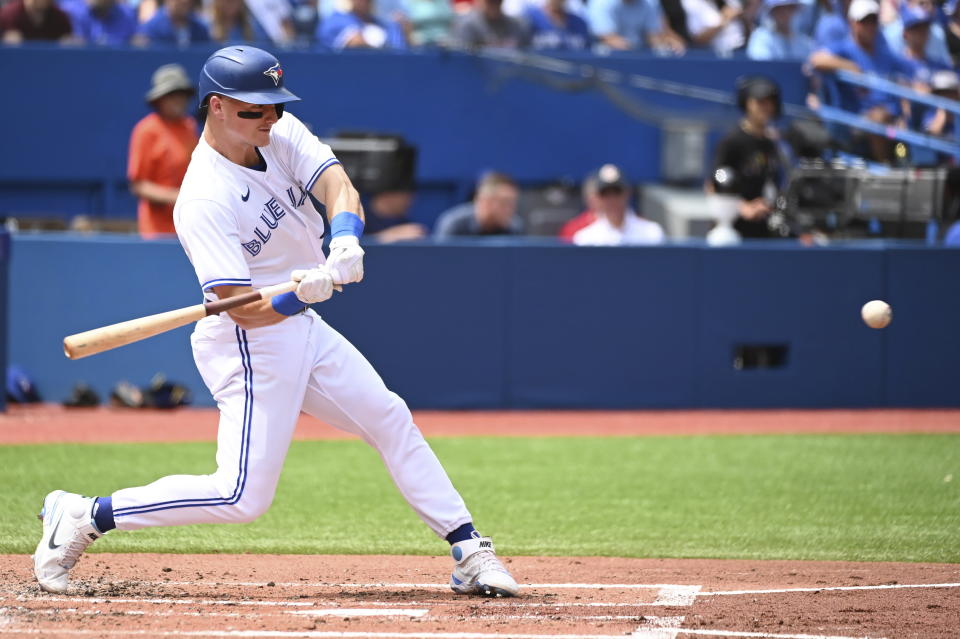 Toronto Blue Jays' Matt Chapman hits a two-run home run also scoring Teoscar Hernandez in the second inning of a baseball game in Toronto, Sunday, July 31, 2022. (Jon Blacker/The Canadian Press via AP)