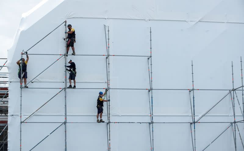 People work on a superyacht at MB92 Group facilites in Barcelona