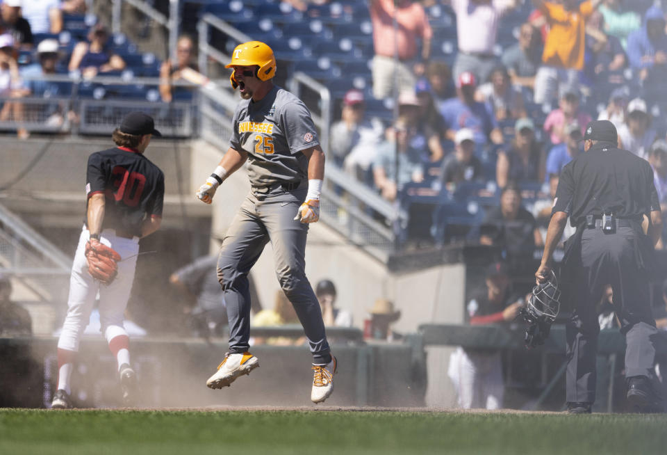 FILE - Tennessee's Blake Burke (25) celebrates after stealing home on a wild pitch against Stanford in the seventh inning of a baseball game at the NCAA College World Series in Omaha, Neb., Monday, June 19, 2023. Tennessee defeated Stanford 6-4. Virginia, Tennessee and Florida are playing in the College World Series for the second straight year, and each brought back the majority of their lineups.(AP Photo/Rebecca S. Gratz, File)