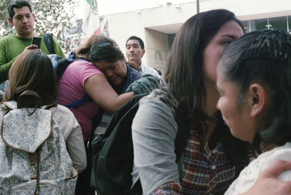 Students comfort mothers of the 43 missing students at a rally at the Metropolitan Autonomous University in Mexico City on Jan. 23, 2015.