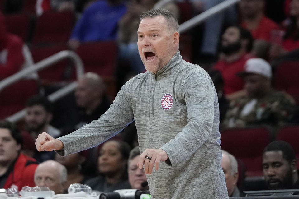 Denver Nuggets coach Michael Malone calls a play during the first half of an NBA basketball game against the Houston Rockets Sunday, Nov. 12, 2023, in Houston. (AP Photo/David J. Phillip)