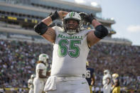 Marshall offensive lineman Logan Osburn celebrates a score against Notre Dame during an NCAA college football game Saturday, Sept. 10, 2022, in South Bend, Ind. Marshall won 26-21. (Sholten Singer/The Herald-Dispatch via AP)