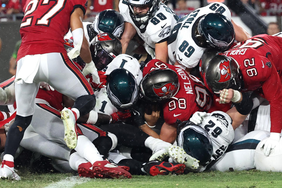 Jalen Hurts rushes for a TD against the Bucs on Monday night. (Mike Carlson/Getty Images)