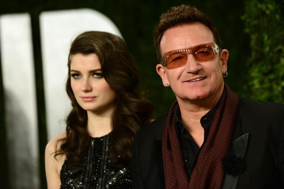 From left, actress Eve Hewson and musician Bono arrive at the 2013 Vanity Fair Oscars Viewing and After Party on Sunday, Feb. 24 2013 at the Sunset Plaza Hotel in West Hollywood, Calif. (Photo by Jordan Strauss/Invision/AP)