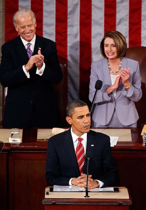 Vice President Joseph Biden and U.S. Speaker of the House Rep. Nancy Pelosi look on as President Barack Obama speaks to both houses of Congress during his first State of the Union address at the U.S. Capitol on January 27, 2010. (Photo by Chip Somodevilla/Getty Images)