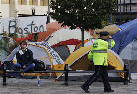 A man meditates outside the Occupy Boston encampment in Boston, Massachusetts October 11, 2011. REUTERS/Brian Snyder