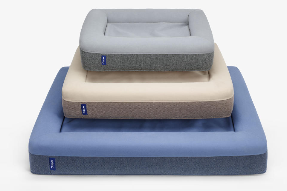 This photo provided by Casper shows an assortment of the company's pet beds in different colors and sizes. The beds are made of supportive, comforting foam with a durable, machine-washable outer cover that sheds fur and withstands bites and scratches. No longer are furniture companies content to offer you staples like a sofa, easy chair and bed. Now they have those items for your pet, too, designed not to clash with the rest of your decor. Pottery Barn, Crate and Barrel, Ikea, Casper mattresses and other popular furniture purveyors have lines for pets, often in styles that complement their human-size living room furniture. (Casper via AP)