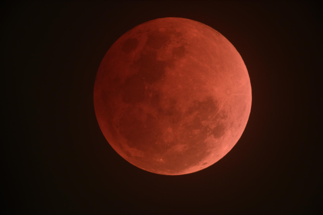 View of the super blue blood moon observed from the Science Centre Singapore at 9.49pm, on 31 January 2018. Photo: Ang Poon Seng/The Astronomical Society of Singapore (TASOS)