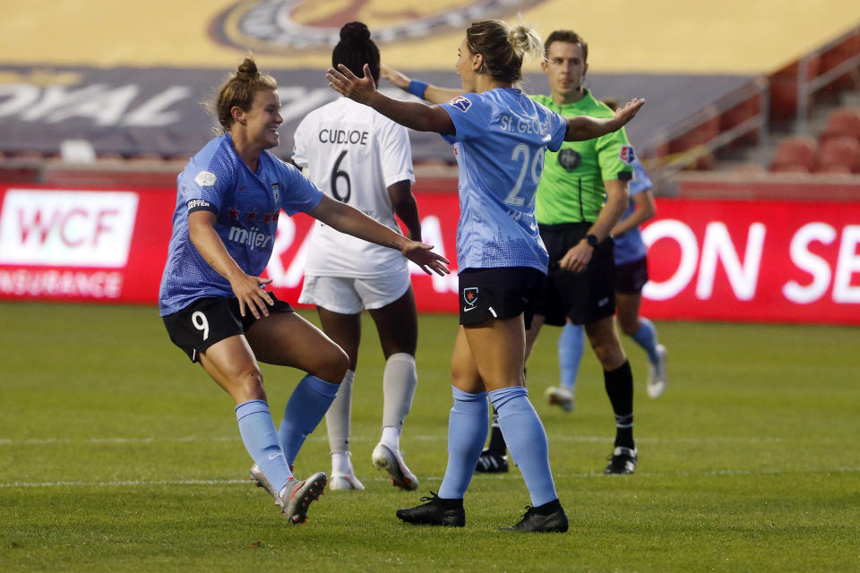 Chicago Red Stars' Bianca St. George (29) celebrates with teammate Savannah McCaskill (9) after scoring against the Sky Blue during the first half of an NWSL Challenge Cup soccer semifinal match Wednesday, July 22, 2020, in Sandy, Utah. (AP Photo/Rick Bowmer)