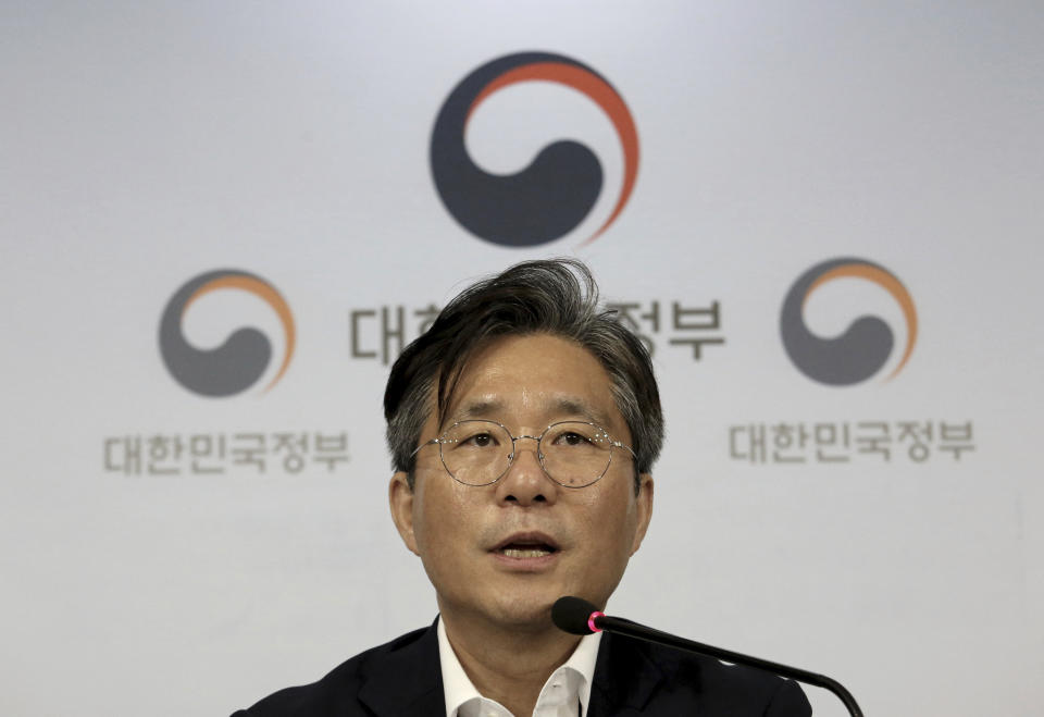 Sung Yun-mo, South Korea's minister of Trade, Industry and Energy, speaks during a press conference at the government complex in Seoul, South Korea, Monday, Aug. 5, 2019. Sung said South Korea will spend 7.8 trillion won ($6.5 billion) over the next seven years to develop technologies for industrial materials and parts as it moves to reduce its dependence on Japan during an escalating trade row. The announcement came days after Japan's Cabinet approved the removal of South Korea from a list of countries with preferential trade status. (AP Photo/Ahn Young-joon)