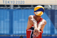 <p>Norway's Christian Sandlie Sorum digs the ball in their men's beach volleyball quarter-final match between Russia and Norway during the Tokyo 2020 Olympic Games at Shiokaze Park in Tokyo on August 4, 2021. (Photo by Martin BERNETTI / AFP)</p> 