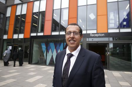 Kamal Hanif, school principal of Waverley School, poses for a portrait at the school in Birmingham, Britain, June 26, 2015.