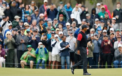 Tiger Woods of the United States reacts after a birdie putt on the seventh green during the final round of The PLAYERS Championship - Credit: Getty Images