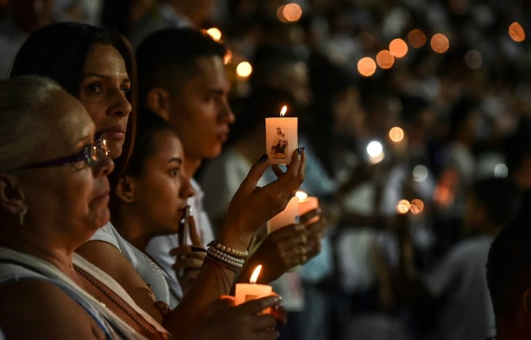 People participate in a tribute to the players of Brazilian team Chapecoense killed in a plane crash in the Colombian mountains