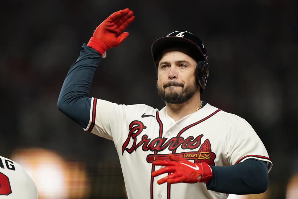 Atlanta Braves' Travis d'Arnaud (16) reacts after an RBI-single during the sixth inning in Game 2 of baseball's National League Division Series between the Atlanta Braves and the Philadelphia Phillies, Wednesday, Oct. 12, 2022, in Atlanta. (AP Photo/Brynn Anderson)