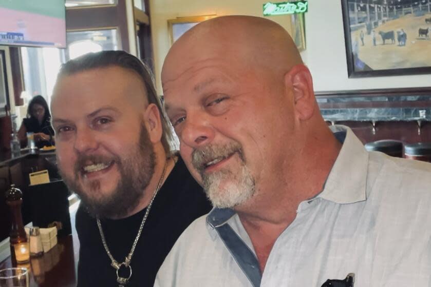 This undated photo provided by Laura Herlovich shows from left, Adam and Rick Harrison. Adam, one of three sons of reality TV show "Pawn Stars" celebrity Richard "Rick" Harrison, has died in Las Vegas, a family representative said Saturday, Jan. 20, 2024. He was 39. (Laura Herlovich via AP)