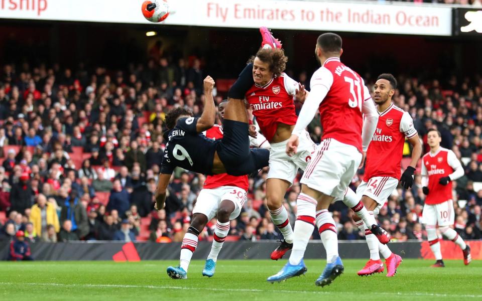 Dominic Calvert-Lewin of Everton scores his team's first goal during the Premier League match between Arsenal FC and Everton FC - GETTY IMAGES