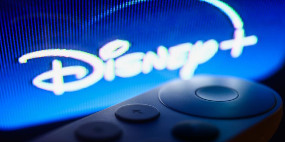 Disney+ logo on Chromecast menu displayed on a TV screen and Chromecast remote control are seen in this illustration photo taken in Krakow, Poland on July 19, 2023.