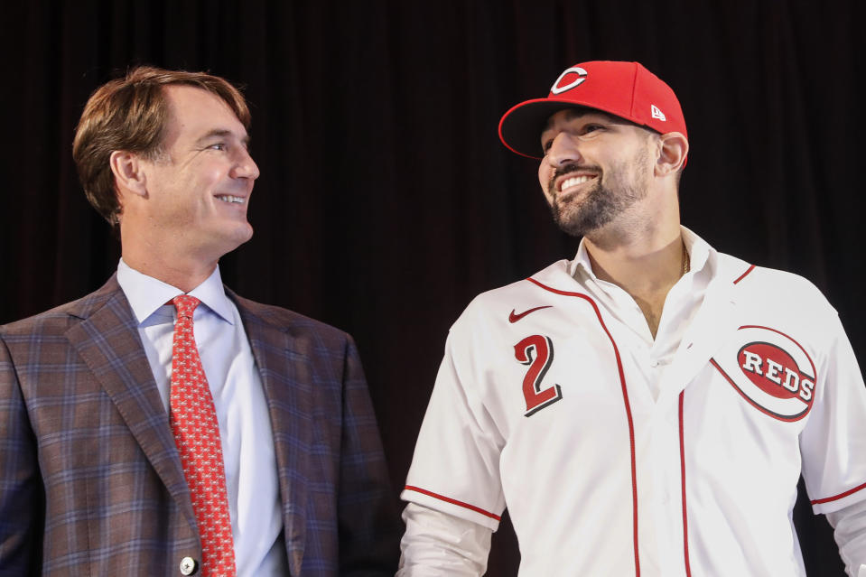 Cincinnati Reds 'Nick Castellanos, right, wears his jersey alongside Reds president and director of operations Dick Williams during a news conference, Tuesday, Jan. 28, 2020, in Cincinnati. Castellanos signed a $64 million, four-year deal with the baseball club. (AP Photo/John Minchillo)