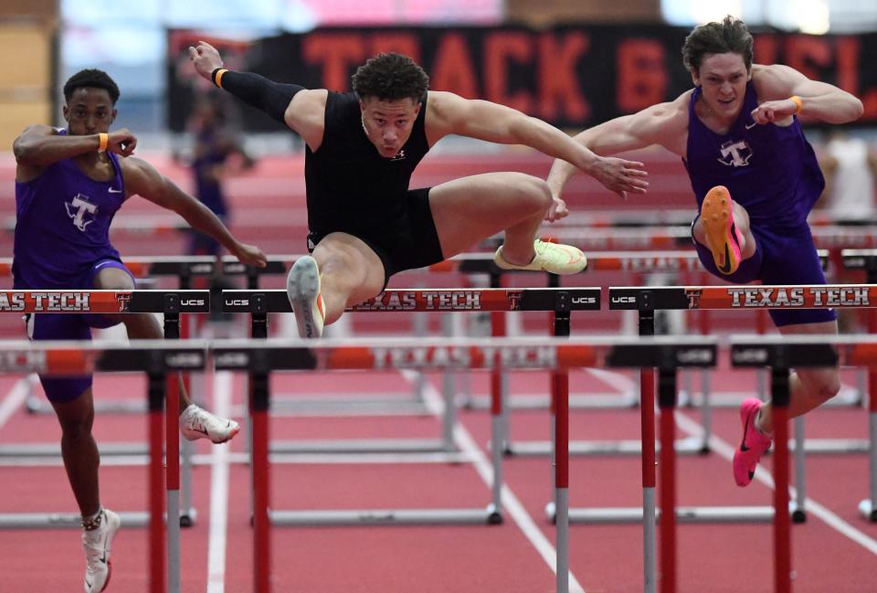 First-semester freshman Mike Dingle runs the 60-meter hurdles during Texas Tech's Jarvis Scott Open last week. Dingle, a Tech football signee, is dividing his time this winter between football conditioning workouts and track and field.