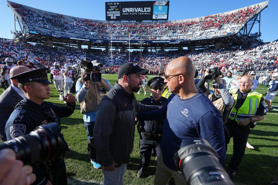 Buckeyes coach Ryan Day, left, and Nittany Lions coach James Franklin are scheduled to square off again Saturday.