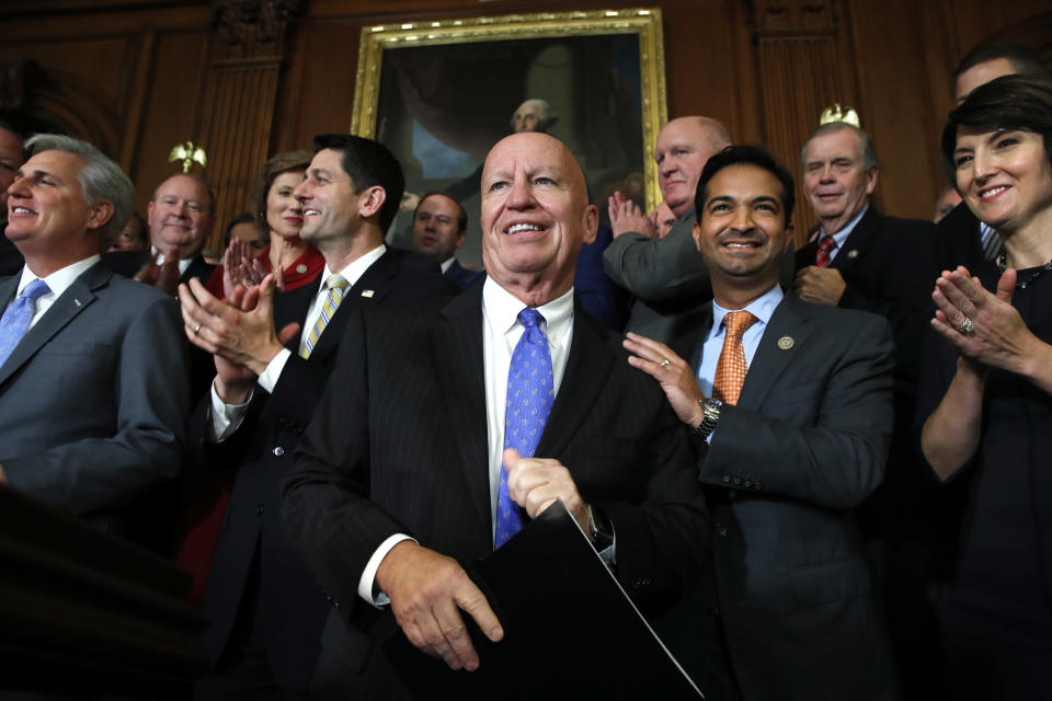 House Ways and Means Chair Rep. Kevin Brady, R-Texas, center, is welcomed by House Republicans including from left, House Majority Leader Kevin McCarthy of Calif., House Speaker Paul Ryan of Wis., Rep. Carlos Curbelo, R-Fla., and Rep. Cathy McMorris Rodgers, R-Wash., as they arrive to speak to the media following a vote on the GOP tax bill, Thursday, Nov. 16, 2017, on Capitol Hill in Washington. (AP Photo/Jacquelyn Martin)