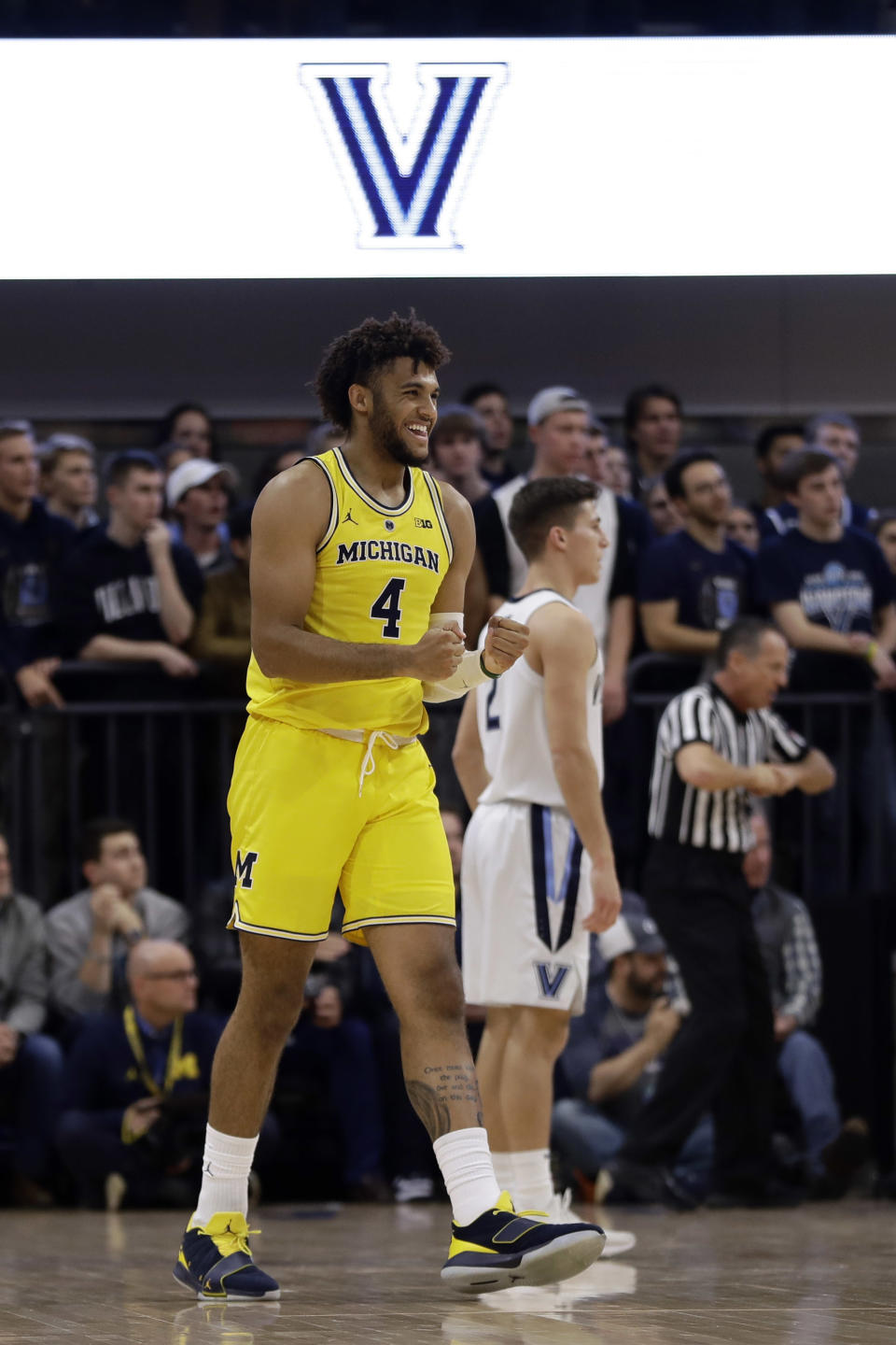 Michigan's Isaiah Livers reacts after a basket during the first half of an NCAA college basketball game against Villanova, Wednesday, Nov. 14, 2018, in Villanova. (AP Photo/Matt Slocum)