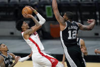 Houston Rockets center Christian Wood (35) shoots against San Antonio Spurs center LaMarcus Aldridge (12) during the second half of an NBA basketball game in San Antonio, Thursday, Jan. 14, 2021. (AP Photo/Eric Gay)