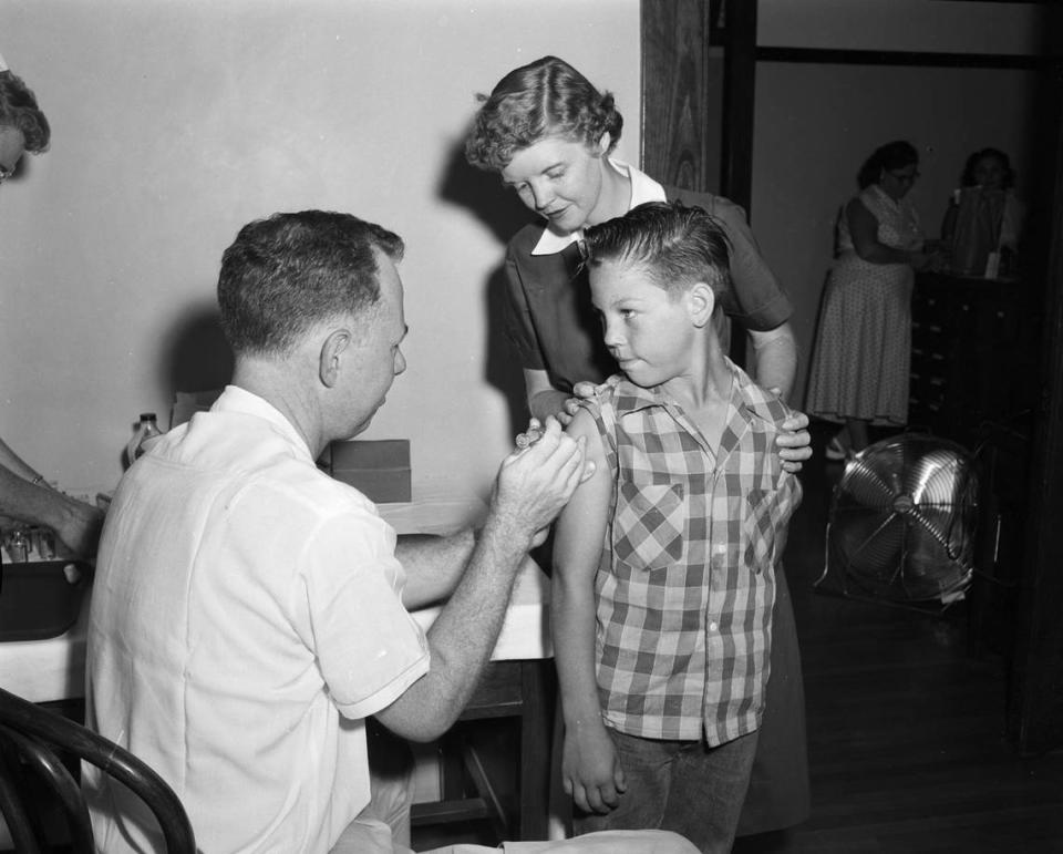 Sept 27, 1955: Kenneth W. Tallant, age 10, receives polio injection at Peter Smith Elementary School in Fort Worth; physician is Doctor N.E. Ross and school nurse is Mrs. Delores Keller.