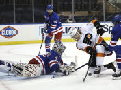 New York Rangers' Igor Shesterkin (31) stops a shot by Philadelphia Flyers' Wade Allison (57) in the first period of an NHL hockey game Thursday, April 22, 2021, in New York. (Elsa/Pool Photo via AP)