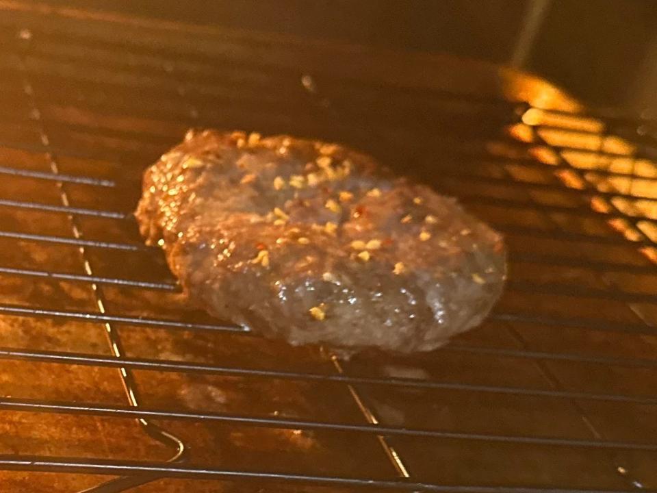 burger patty cooking in a hot oven