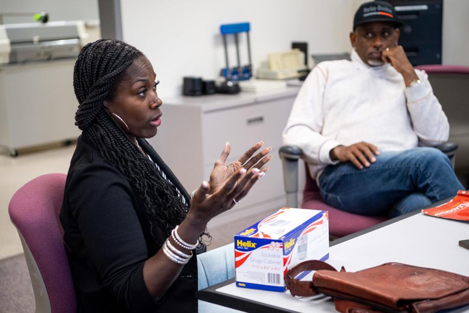 Project Excellence instructor Kimberly Hill speaks with Austin-East Magnet High students as the Rev. Daryl Arnold from Overcoming Believers Church listens.