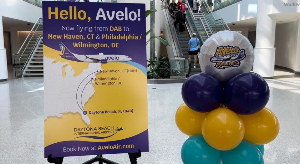 A "Hello, Avelo!" placard greets visitors inside the front entrance to the passenger terminal at Daytona Beach International Airport on June 22, 2023, the day the ultra low-cost airline launched its nonstop service to New Haven, Connecticut. It began nonstop service to Wilmington, Delaware, the next day.