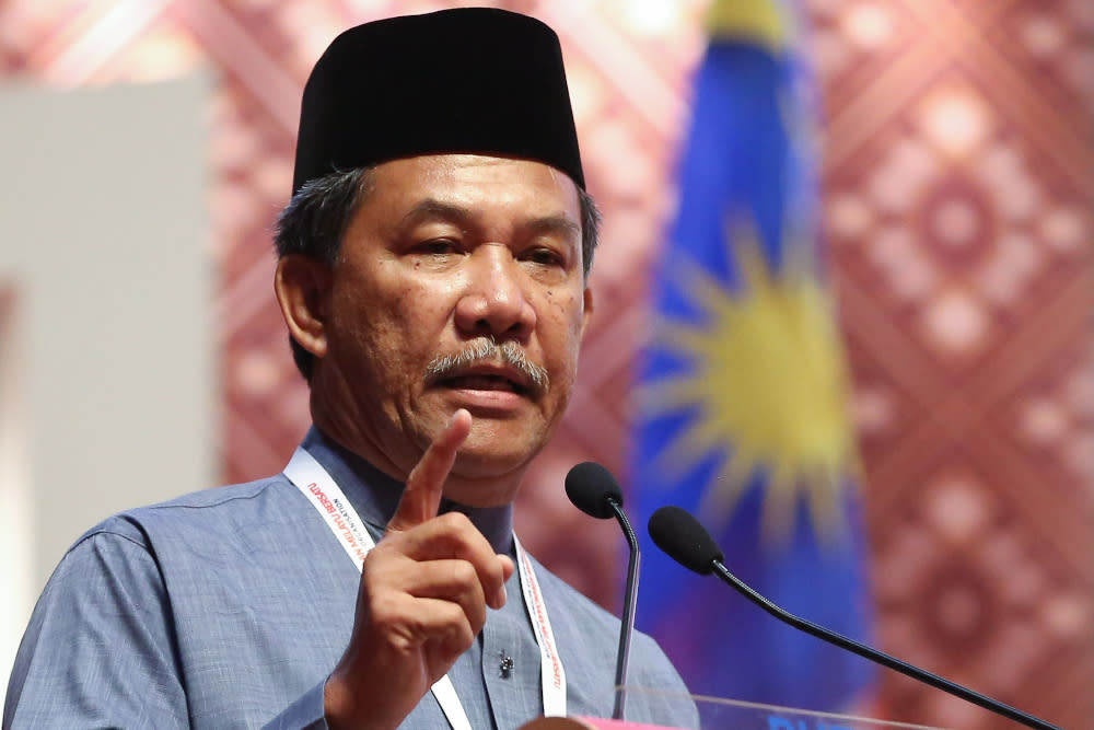 Umno deputy president Datuk Seri Mohamad Hasan speaks at the opening of the Woman, Youth and Puteri wings during the 2019 Umno General Assembly at the PWTC in Kuala Lumpur December 4, 2019. — Picture by Yusof Mat Isa