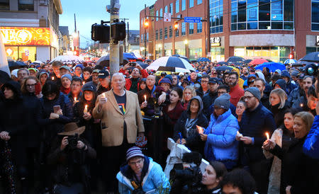 People gathered to mourn the loss of life as they hold a vigil for the victims in Pittsburgh, October 27, 2018. REUTERS/John Altdorfer