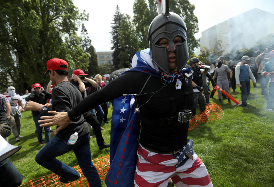 A pro-Trump protester breaks up a scuffle during the Patriots Day Free Speech Rally in Berkeley, California, U.S. April 15, 2017. REUTERS/Jim Urquhart