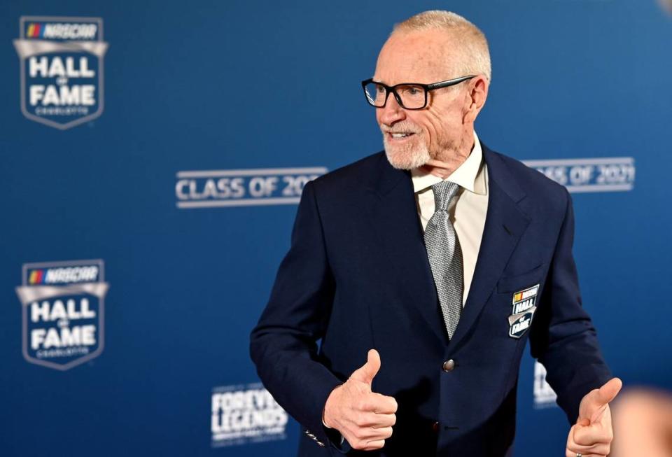 Former NASCAR driver and Hall of Fame member Mark Martin gives the thumbs up to fans as he walks along the red carpet at the NASCAR Hall of Fame in Charlotte, NC on Friday, January 21, 2022.