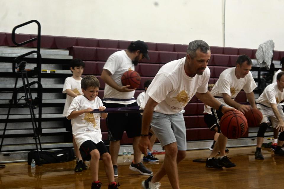 Father and son goes through basketball drills at ‘Father’s Day Leadership Basketball Clinic’ at Florida High, June, 19, 2022