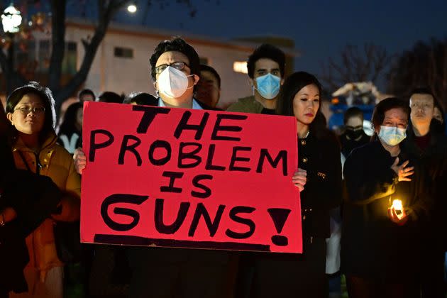 People attend a candlelight vigil on Jan. 24. for victims of a mass shooting in Monterey Park, California.