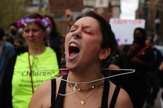 A demonstrator with a clothes hanger around her neck protests in Boston this week.  (Photo: Brian Snyder via Reuters)