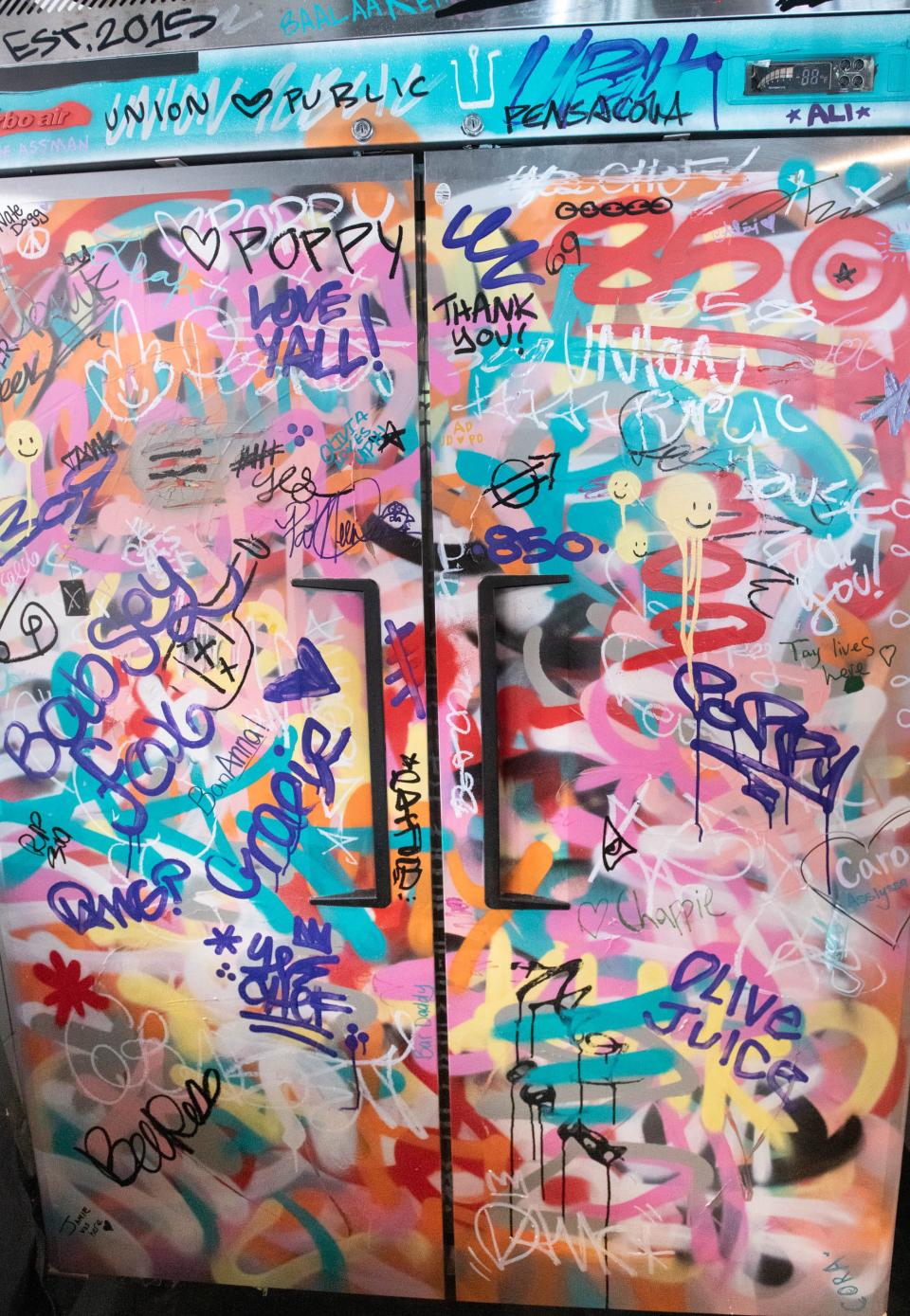 A graffiti refrigerator at the new location of the Union Public House at 36 East Garden Street in Pensacola on Friday, Aug, 25, 2023.