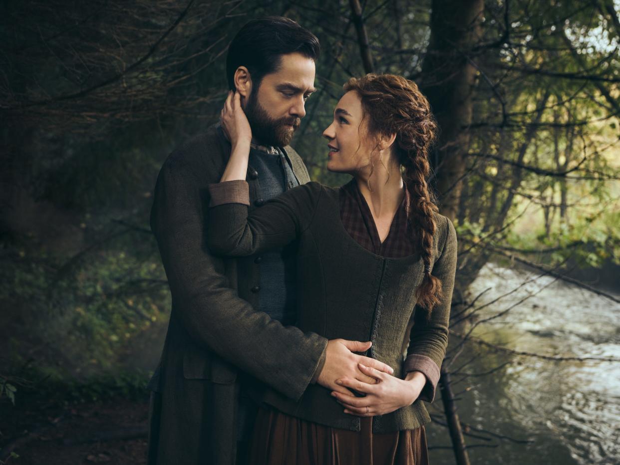 Richard Rankin as Roger MacKenzie and Sophie Skelton as Brianna MacKenzie in "Outlander" season seven.