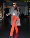 <p>Here’s VB fulfilling all our fall wardrobe goals. We’re drooling over those bright coral trousers, crisp white shirt and her own checkered coat that perfectly picks up on her pants’ eye-catching hue.</p><p><i>Photo: Splash</i></p>