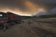 Flames burn on a mountain during a wildfire near Limni village on the island of Evia, about 160 kilometers (100 miles) north of Athens, Greece, Wednesday, Aug. 4, 2021. The European Union promised assistance Wednesday to Greece and other countries in southeast Europe grappling with huge wildfires after a blaze gutted or damaged more than 100 homes and businesses near Athens. (AP Photo/Thodoris Nikolaou)