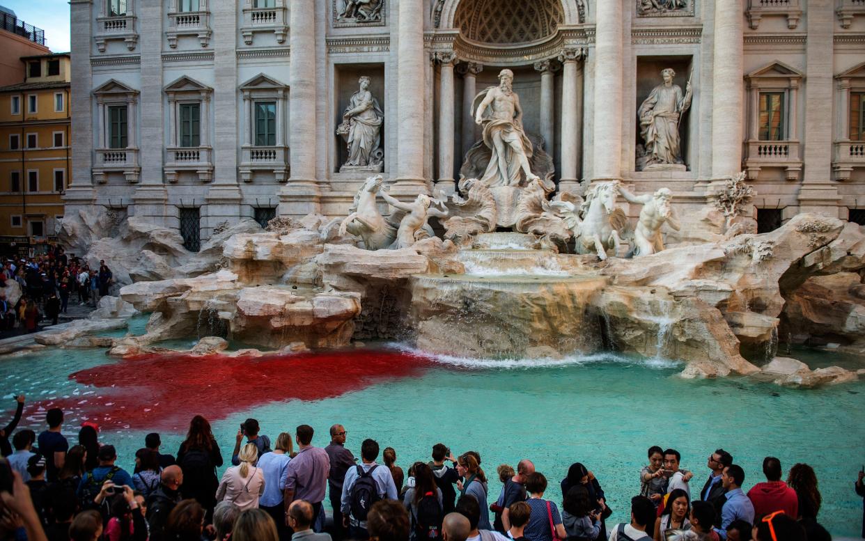 Red dye spreads throughout the famous waters of the Trevi Fountain - 2017 Antonio Masiello