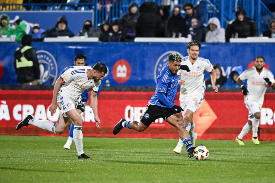 Apr 13, 2024; Montreal, Quebec, CAN; CF Montreal forward Josef Martinez (17) drives the ball past FC Cincinnati defender Matt Miazga (21) during the second half at Stade Saputo. Mandatory Credit: David Kirouac-USA TODAY Sports