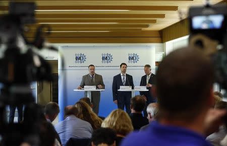 President of the Bavarian State Office of Criminal Investigation Robert Heimberger (L-R), Senior Prosecutor Thomas Steinkraus-Koch and Munich's police vice-superintendent Werner Feiler attend a news conference after a shooting rampage at the the Olympia shopping mal in Munich, Germany July 24, 2016. REUTERS/Arnd Wiegmann